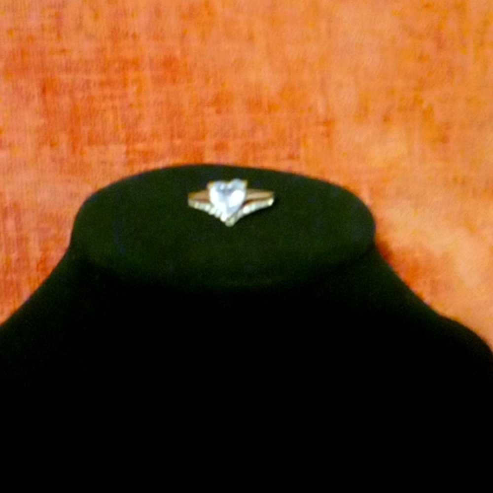 Cubic zirconia and gold plated heart diamond ring.